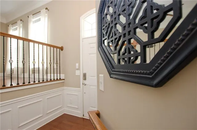 a view of a swimming pool with a table and chairs under an umbrella