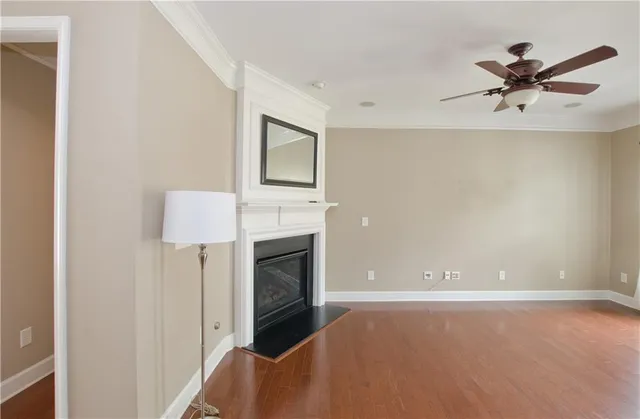 a view of staircase with railing and white walls