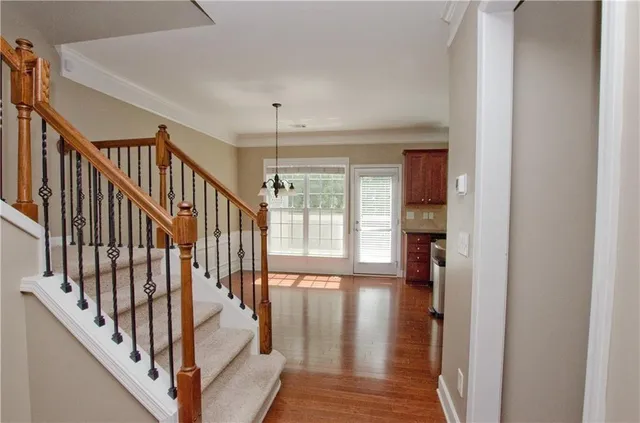 a kitchen with granite countertop a sink a stove and a granite counter top