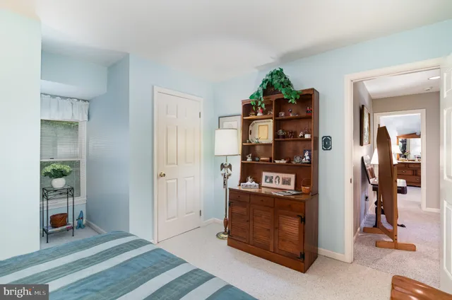 a view of a hallway with room and window