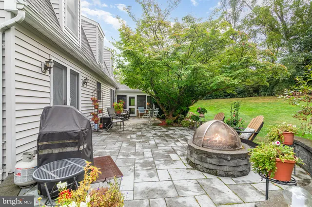 a view of a patio with table and chairs and potted plants