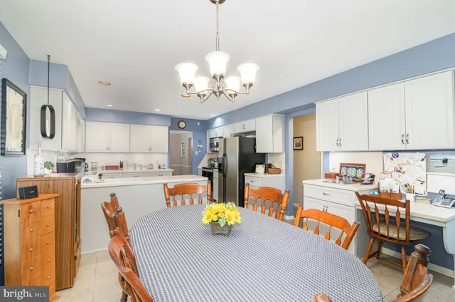 a view of kitchen with cabinets and wooden floor