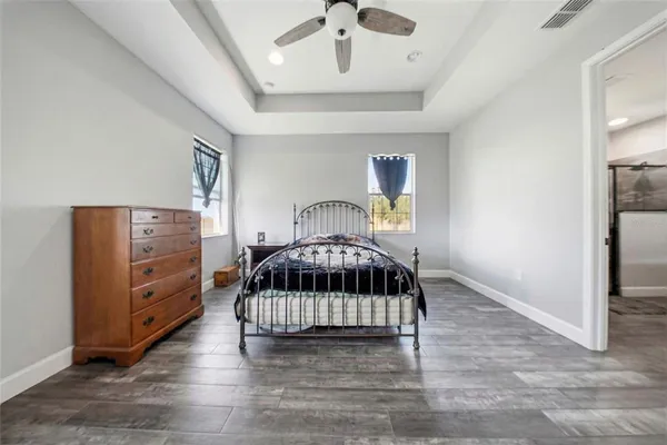 a bedroom with furniture and a window