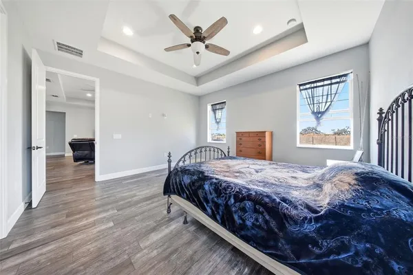 a bedroom with a large bed and a window