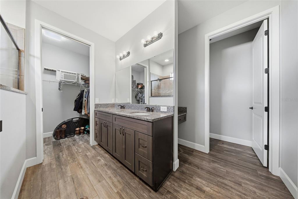 3090 80 Foot Road Bartow, FL 33830 - Photo 18 of 48 a kitchen with a sink cabinets and wooden floor