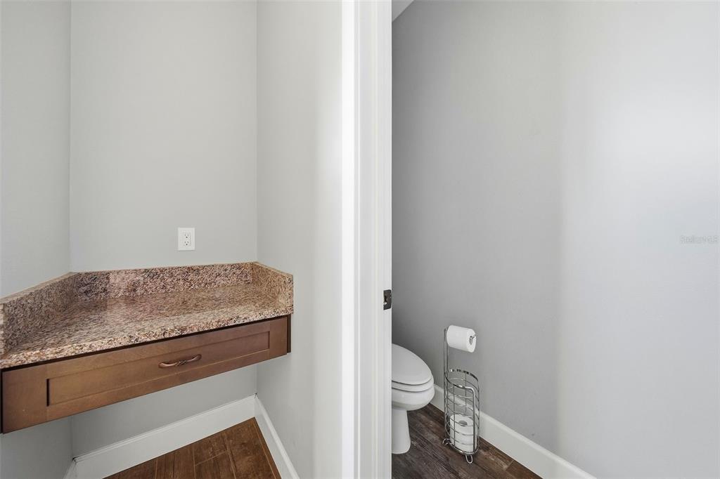 3090 80 Foot Road Bartow, FL 33830 - Photo 21 of 48 a bathroom with a granite countertop toilet and a sink