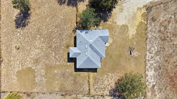 an aerial view of residential house with outdoor space