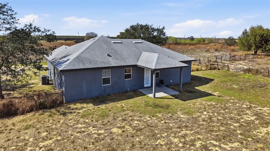 3090 80 Foot Road Bartow, FL 33830 - Photo 32 of 48 a view of a house with a yard