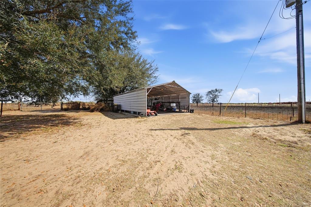 3090 80 Foot Road Bartow, FL 33830 - Photo 35 of 48 a front view of a house with a yard