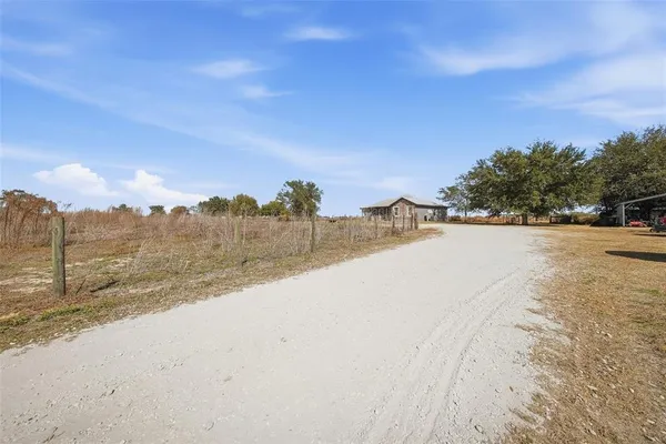 a view of a lake with a building in the background