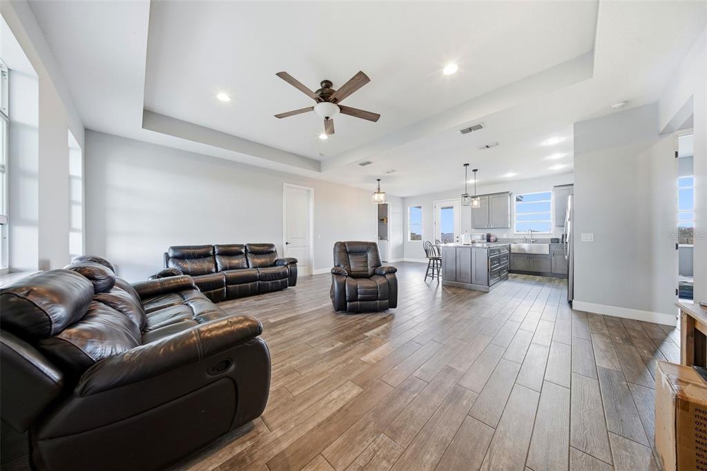 3090 80 Foot Road Bartow, FL 33830 - Photo 7 of 48 a living room with furniture and a wooden floor