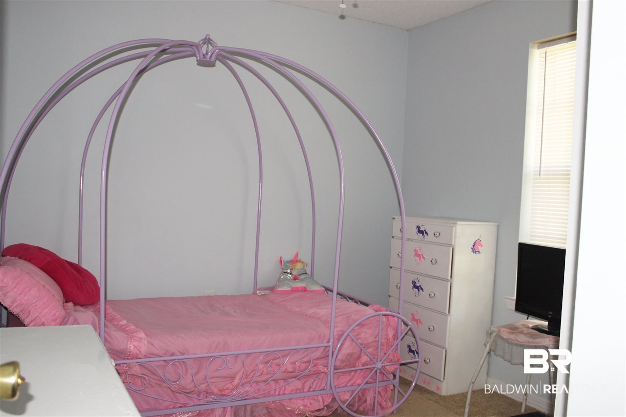 4587 Emerald Drive East Mobile, AL 36619 - Photo 8 of 16 There are two guest bedrooms.