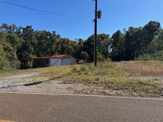 4280 Powell Chapel Road Middleton, TN 38052 - Photo 11 of 12 a backyard of a house with lots of green space