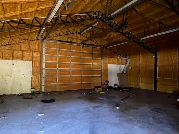 a view of a room with wooden walls