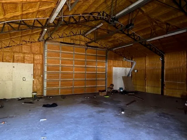 a view of a room with wooden walls