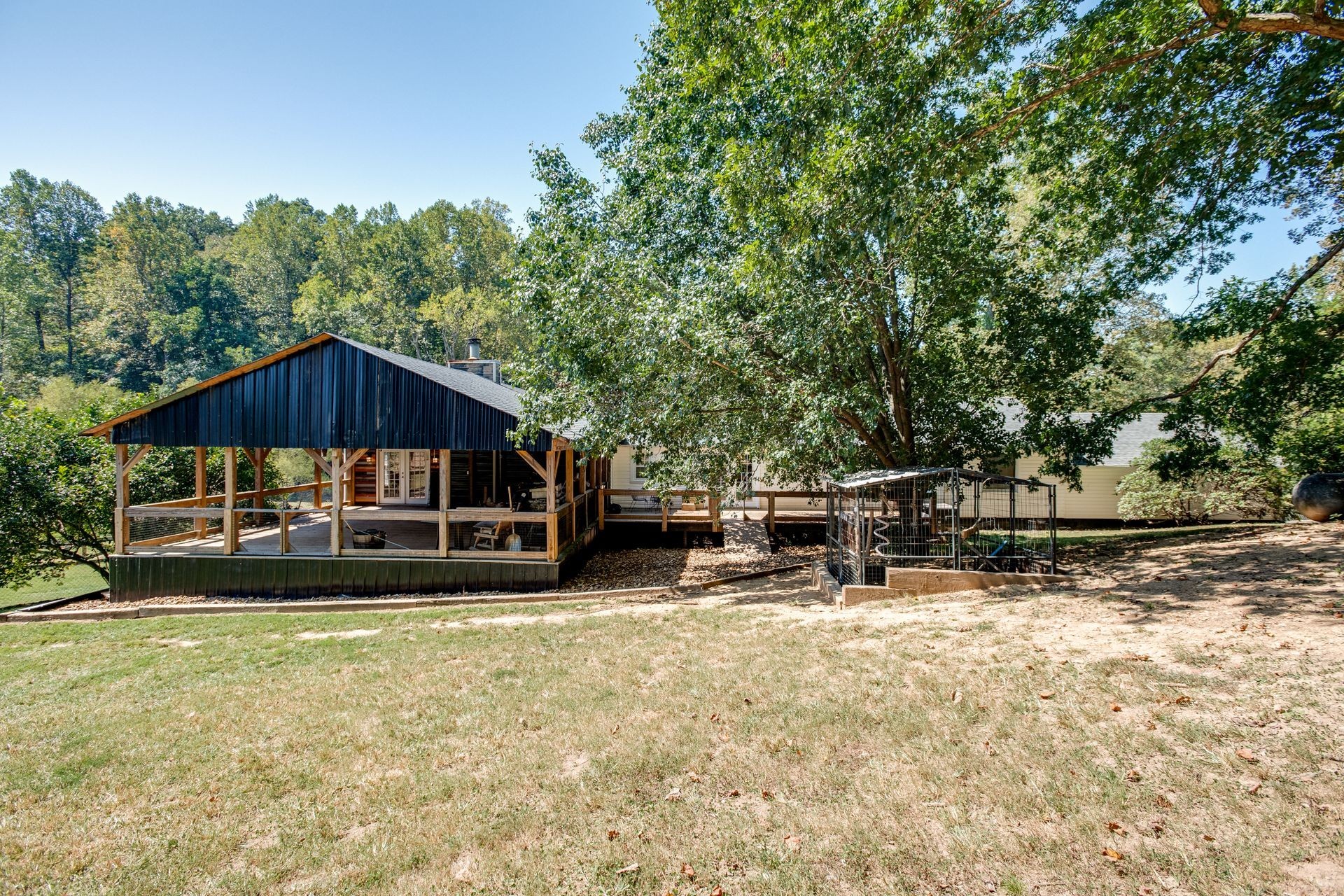 5544 Bales Road Cunningham, TN 37052 - Photo 54 of 64 a view of a house with a yard and sitting area