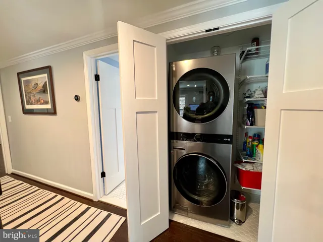 a view of a hallway with washer and dryer