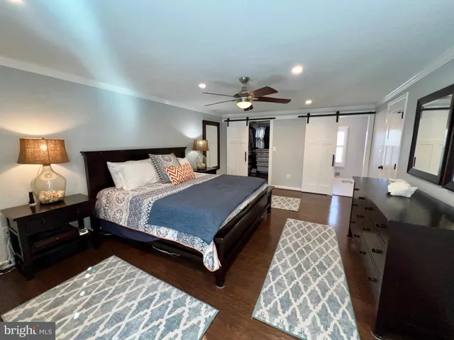 a bedroom with bed and window