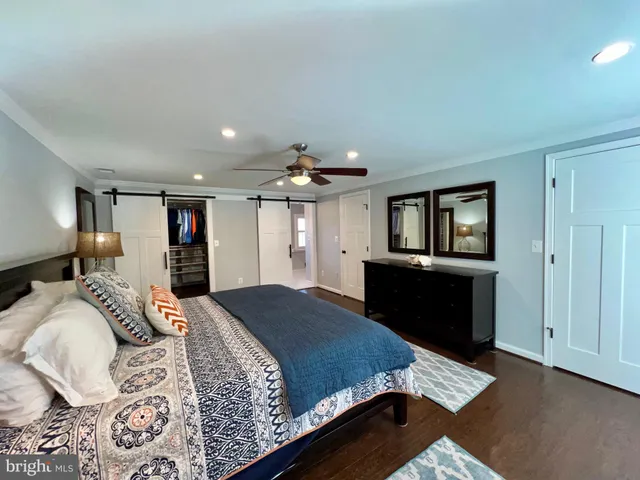 a view of walk in closet with clothes