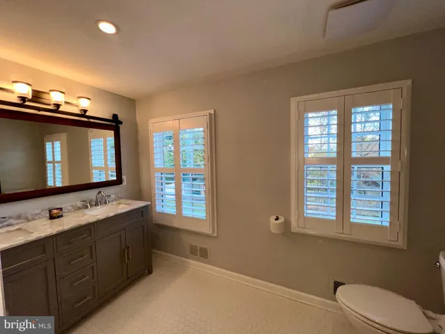 a bedroom with a bed and a walk in closet
