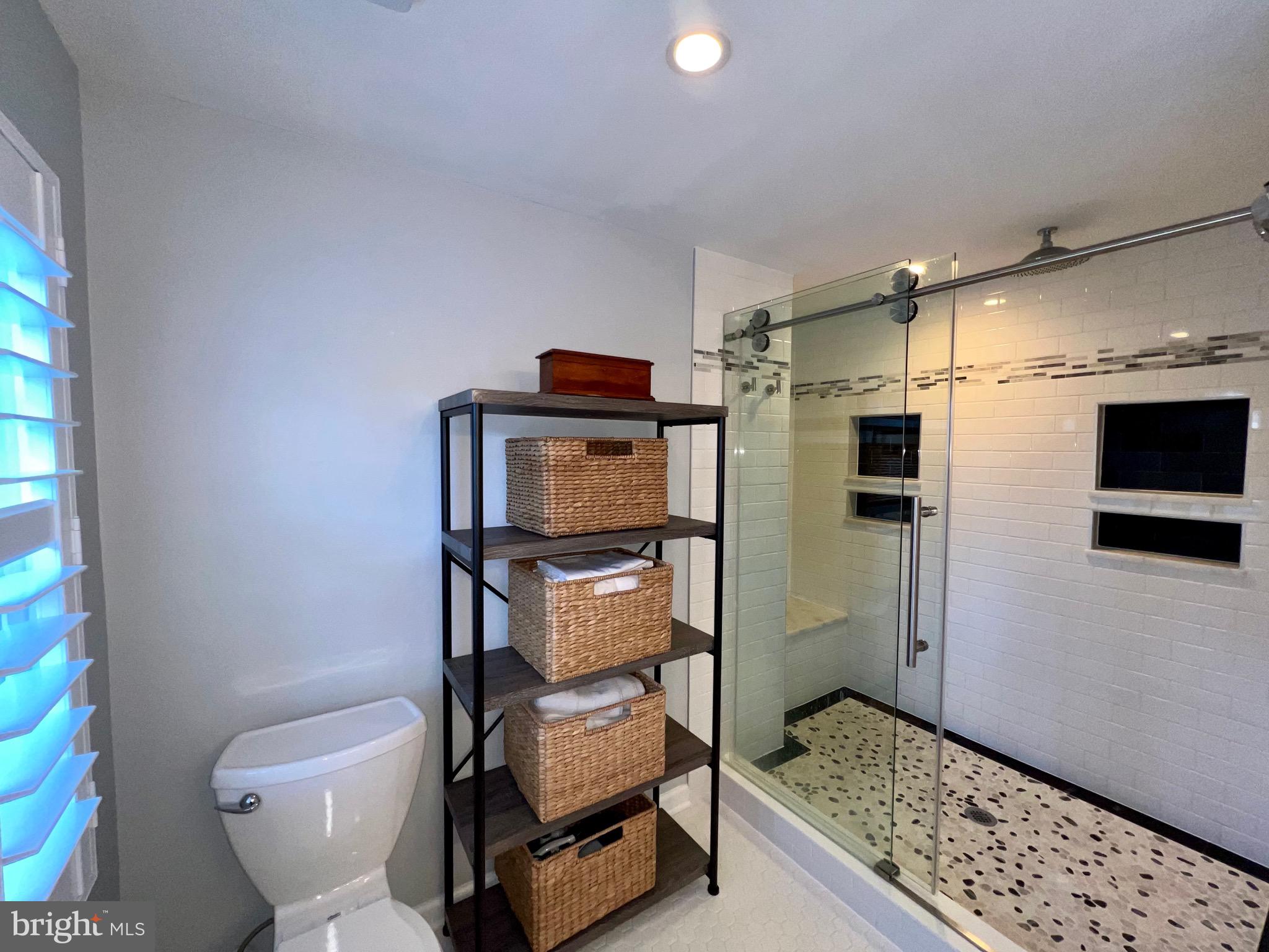 909 St Stephens Road Alexandria, VA 22304 - Photo 19 of 40 a bathroom with a toilet and a shower