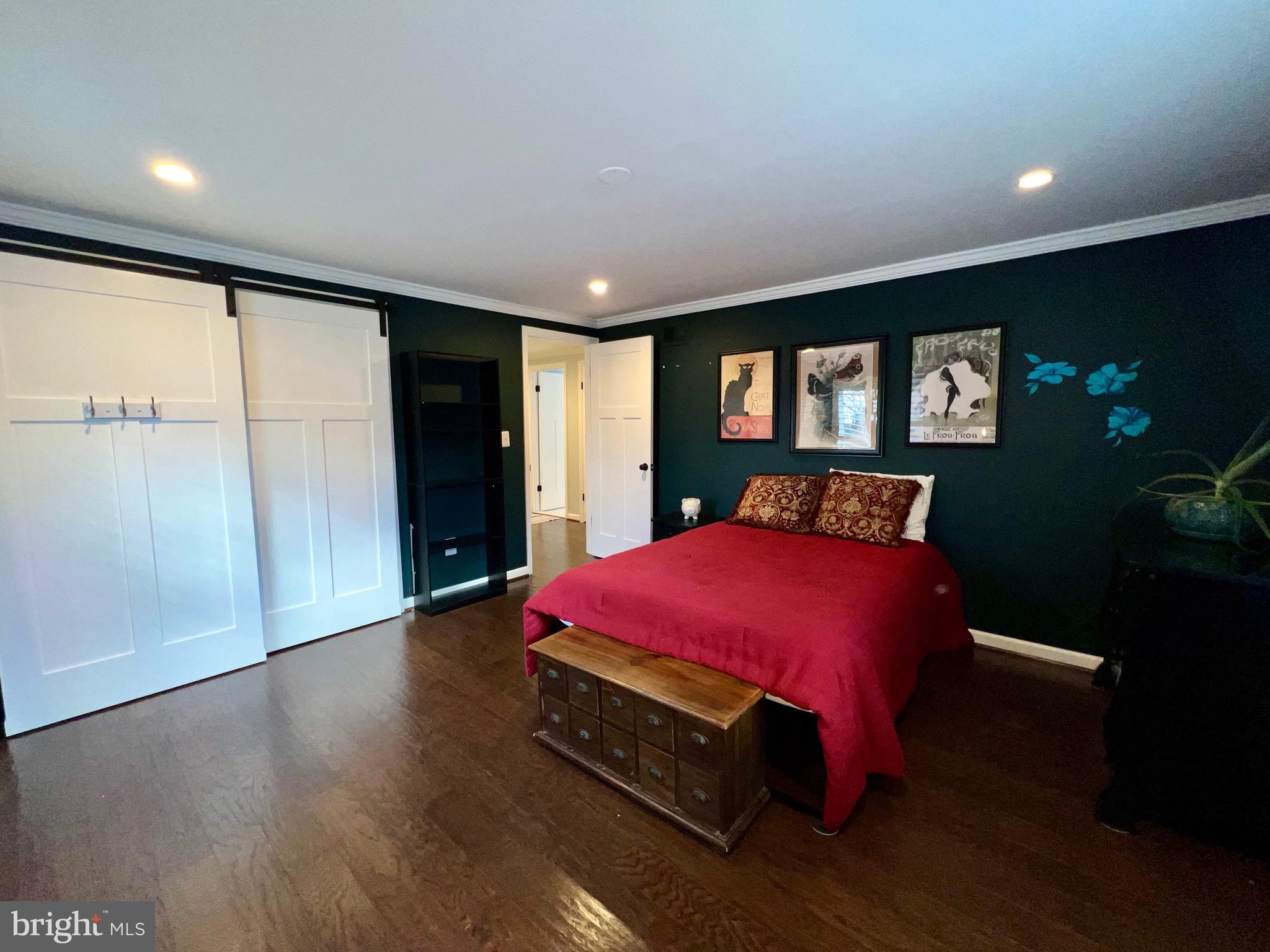 909 St Stephens Road Alexandria, VA 22304 - Photo 23 of 40 a bedroom with a bed and a large mirror