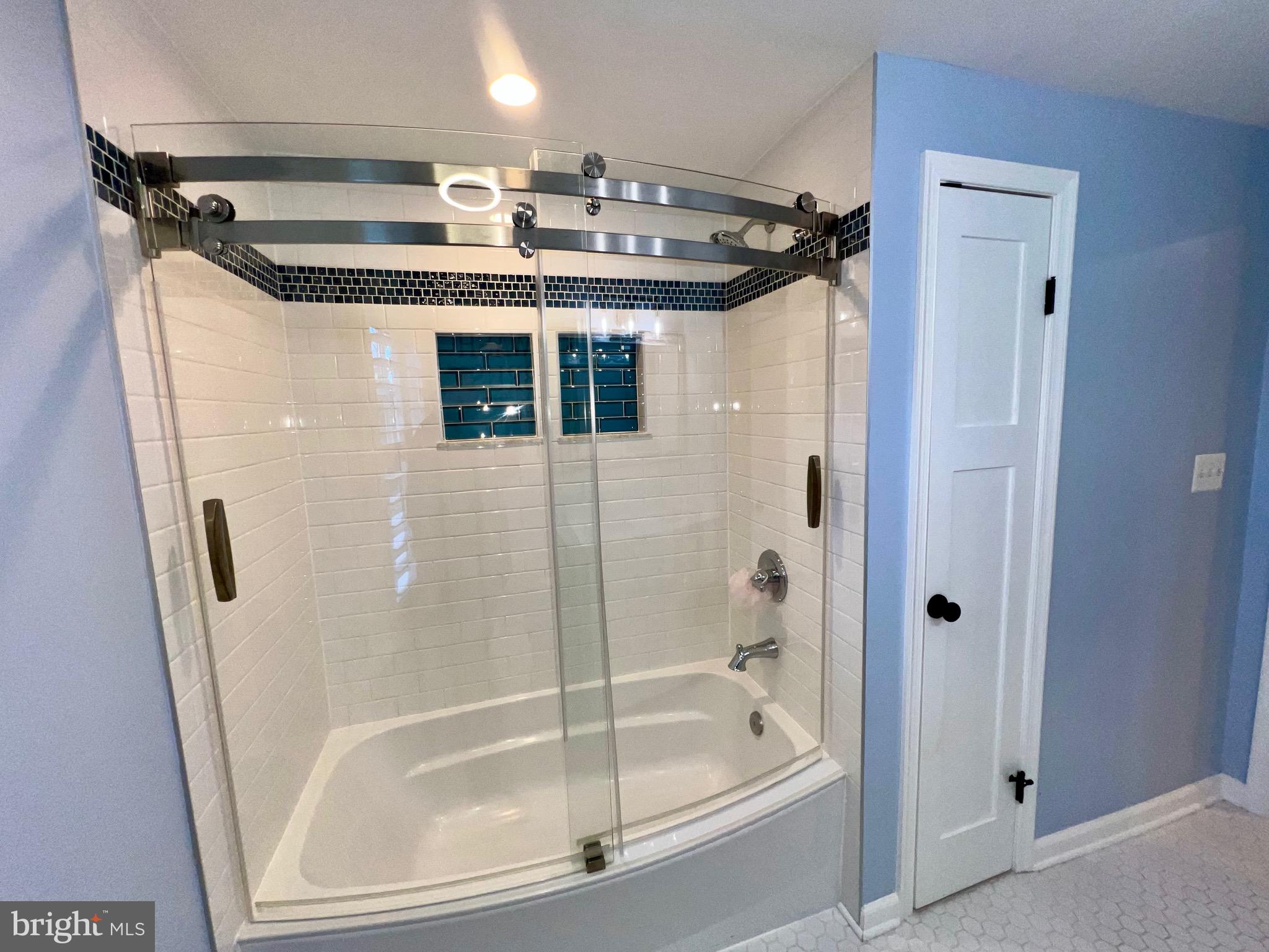 909 St Stephens Road Alexandria, VA 22304 - Photo 27 of 40 a bathroom with a tub and a shower