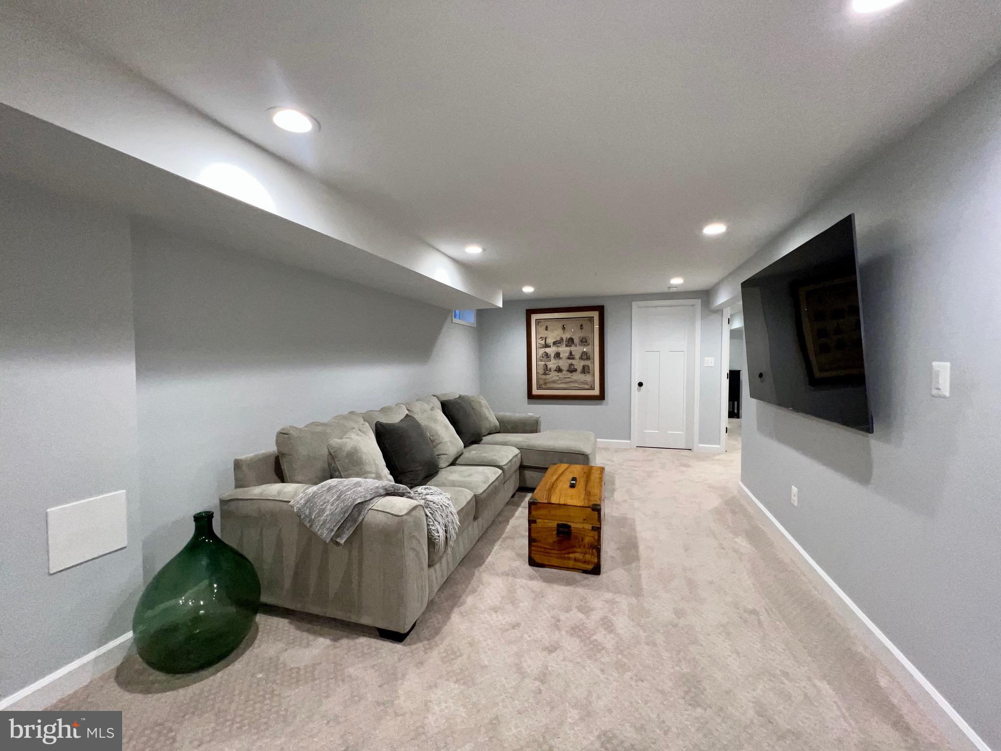 909 St Stephens Road Alexandria, VA 22304 - Photo 30 of 40 a living room with furniture and a flat screen tv