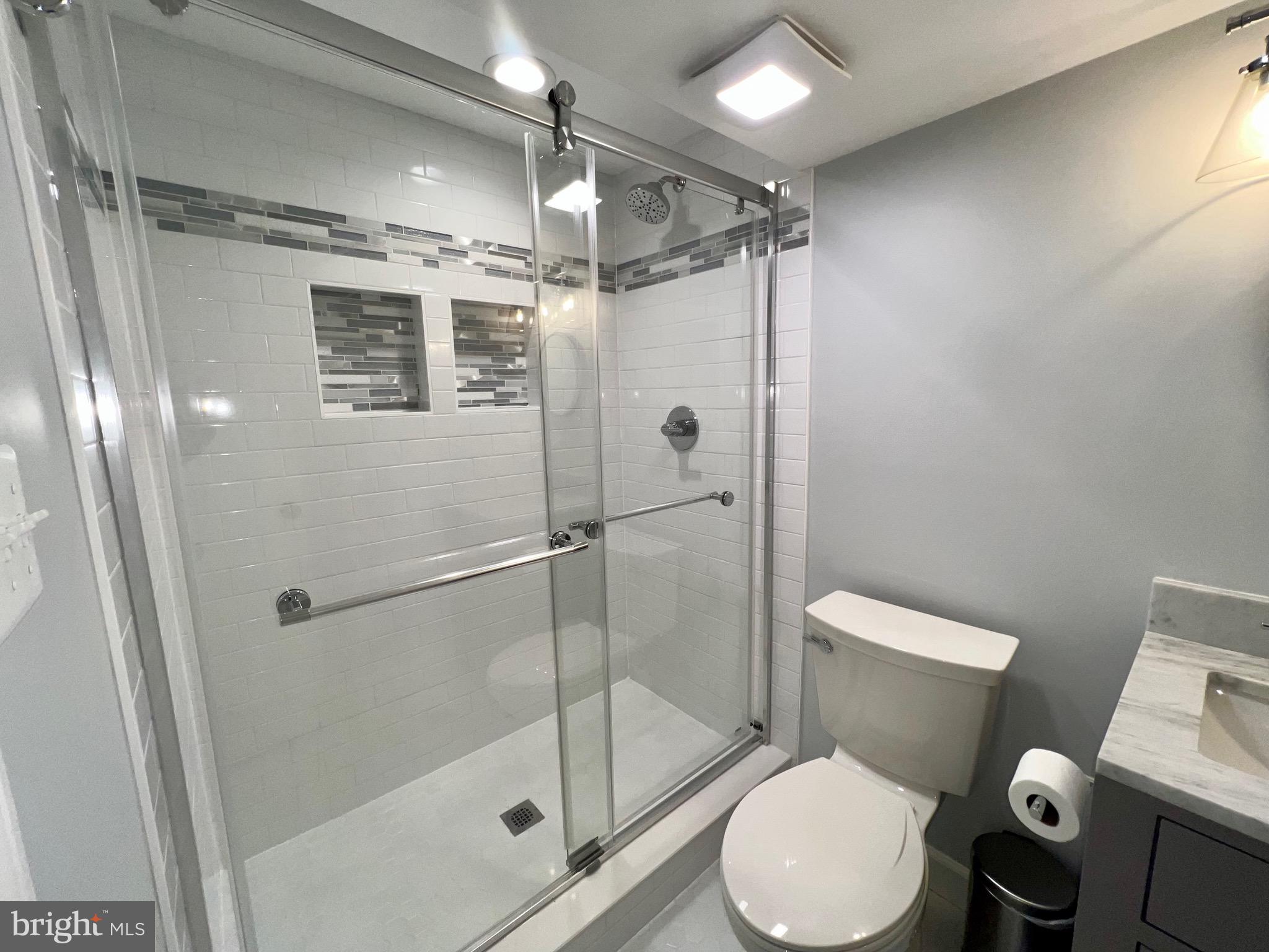 909 St Stephens Road Alexandria, VA 22304 - Photo 31 of 40 a bathroom with a toilet and a shower