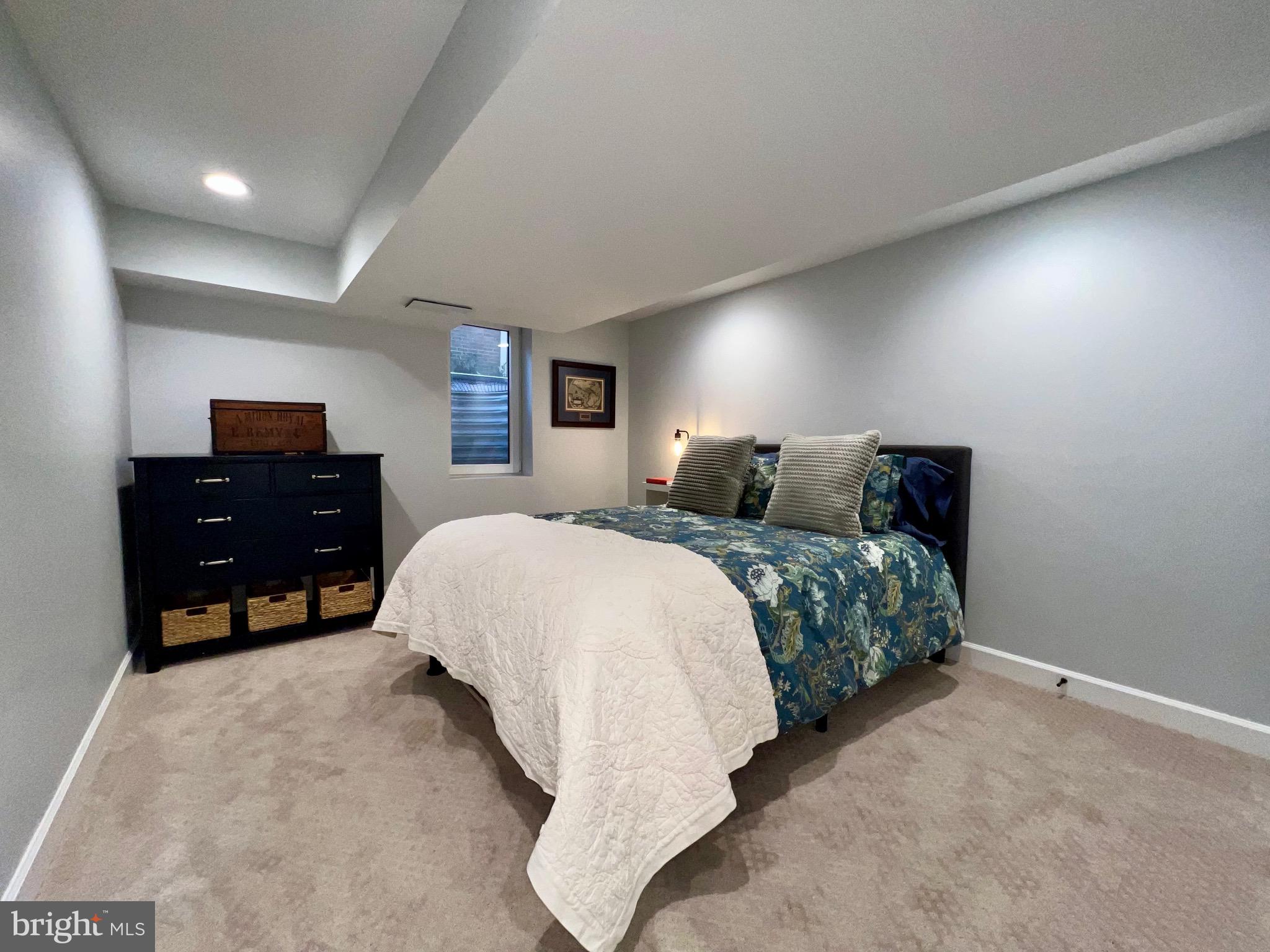909 St Stephens Road Alexandria, VA 22304 - Photo 33 of 40 a bedroom with a bed and dresser