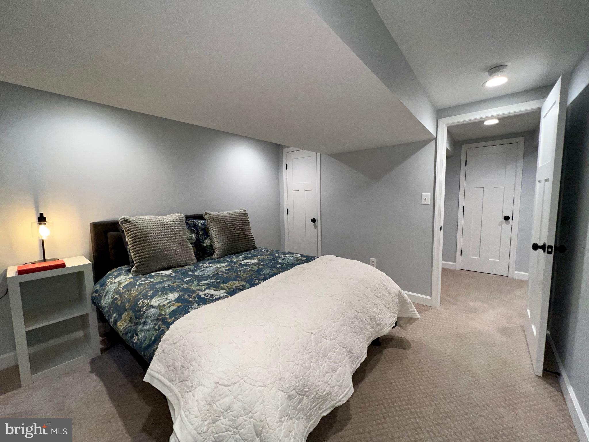 909 St Stephens Road Alexandria, VA 22304 - Photo 34 of 40 a bedroom with bed and a night stand