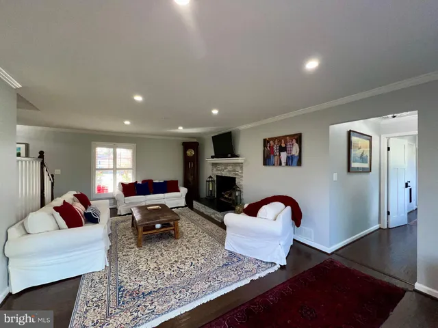 a living room with furniture fireplace and window