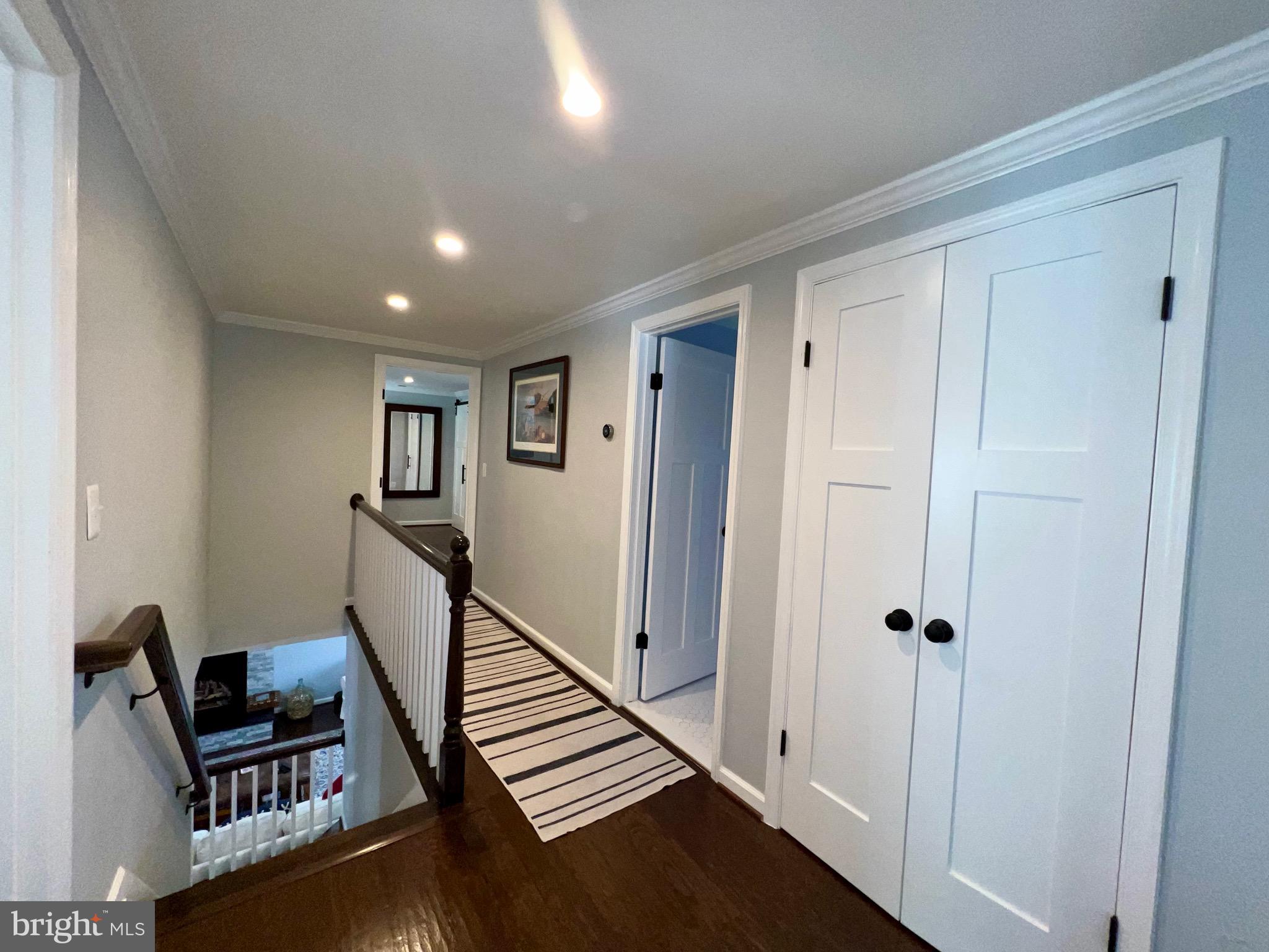 909 St Stephens Road Alexandria, VA 22304 - Photo 10 of 40 a view of a hallway with wooden floor and staircase