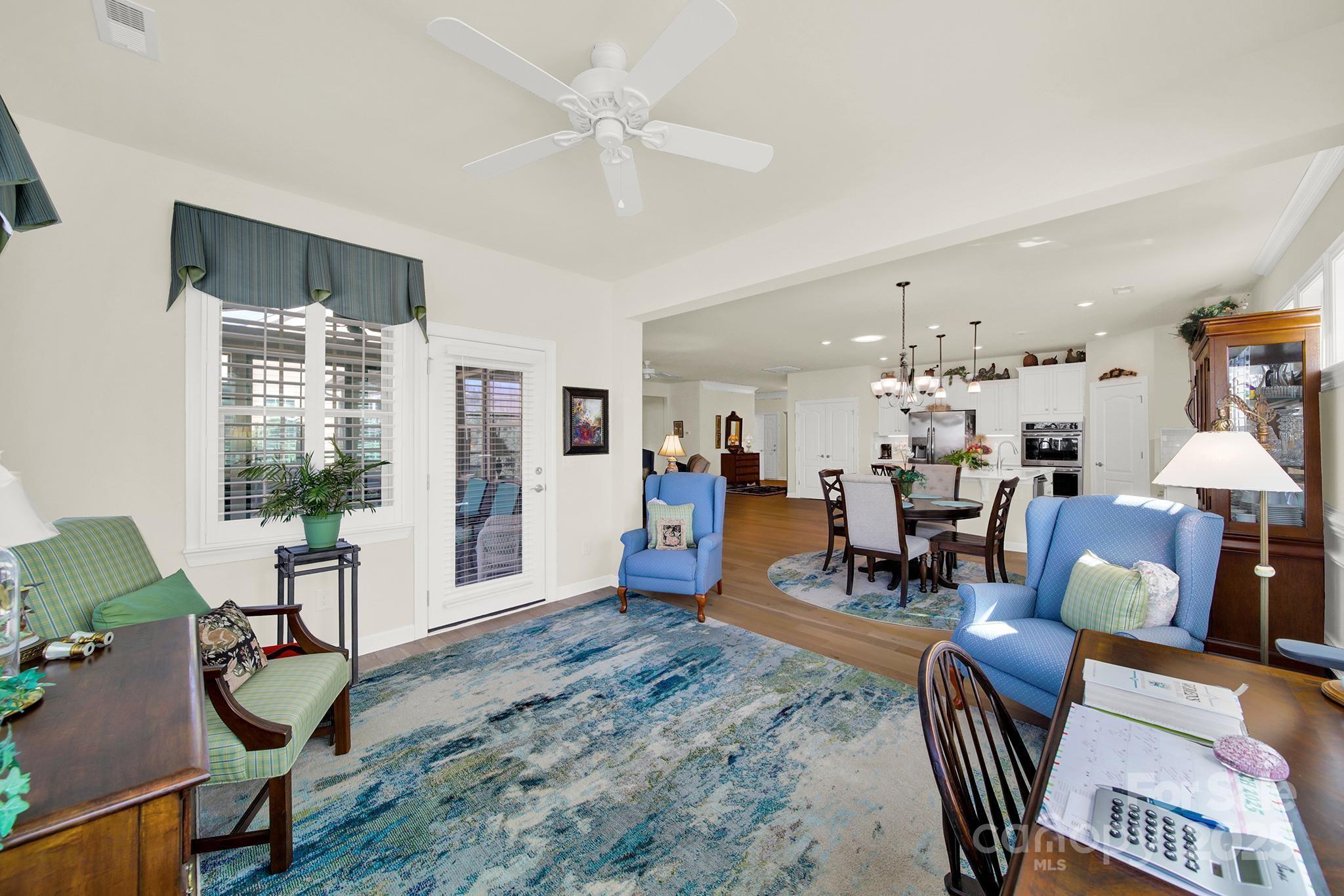 3097 Arches Bluff Circle Lancaster, SC 29720 - Photo 12 of 40 a living room with furniture and wooden floor