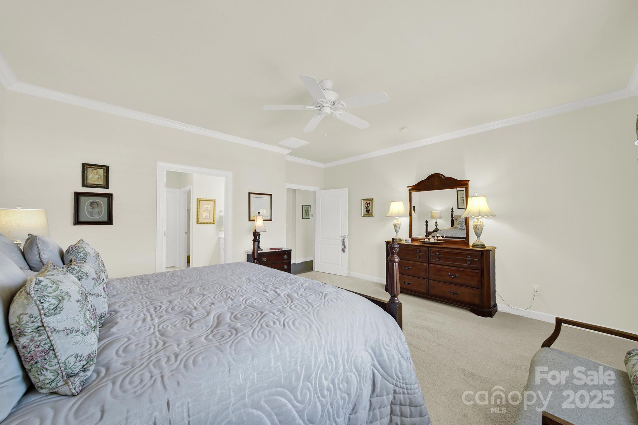 3097 Arches Bluff Circle Lancaster, SC 29720 - Photo 16 of 40 a bedroom with a bed and wooden floor