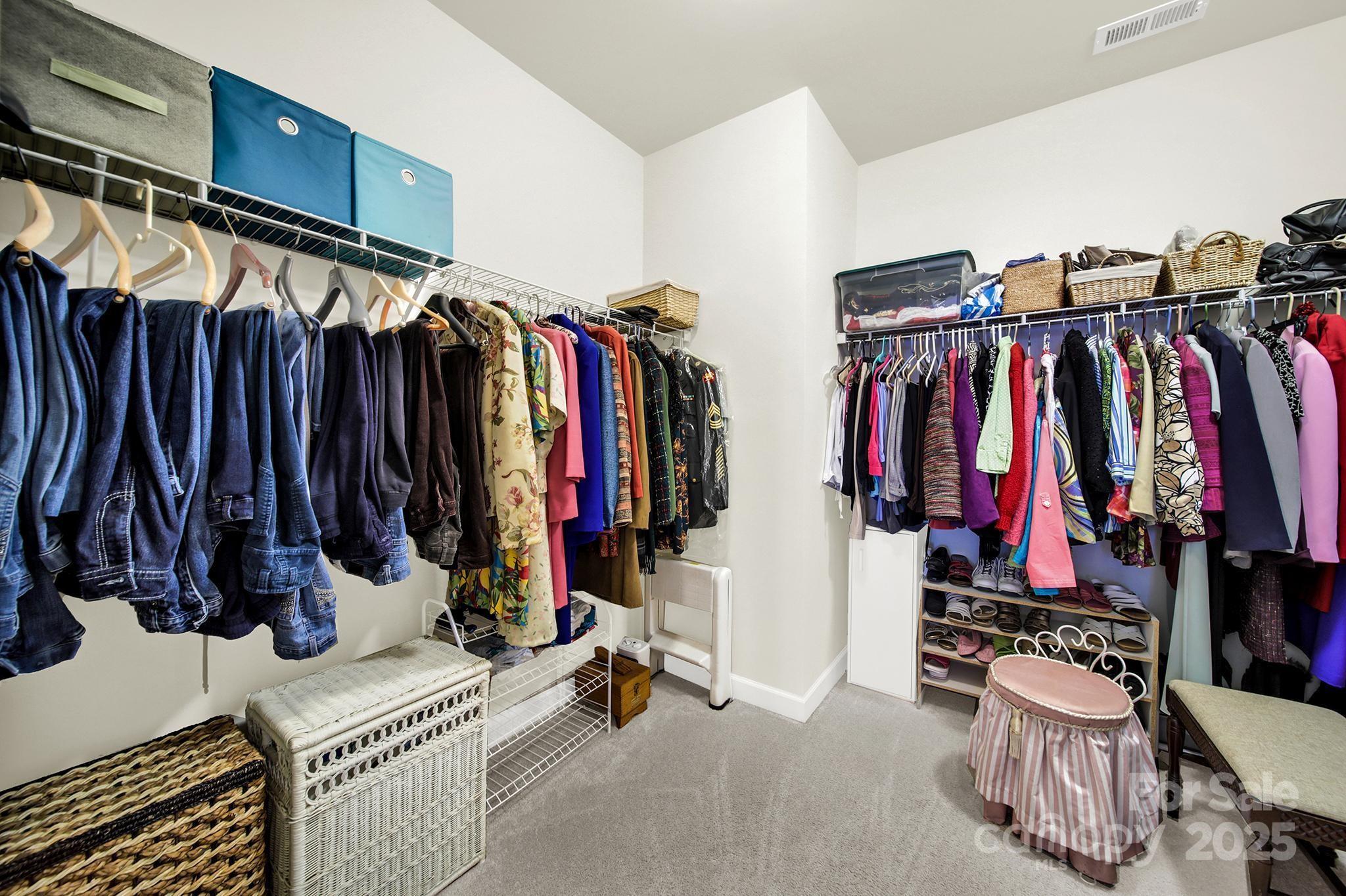 3097 Arches Bluff Circle Lancaster, SC 29720 - Photo 19 of 40 a view of walk in closet with clothes and shoes