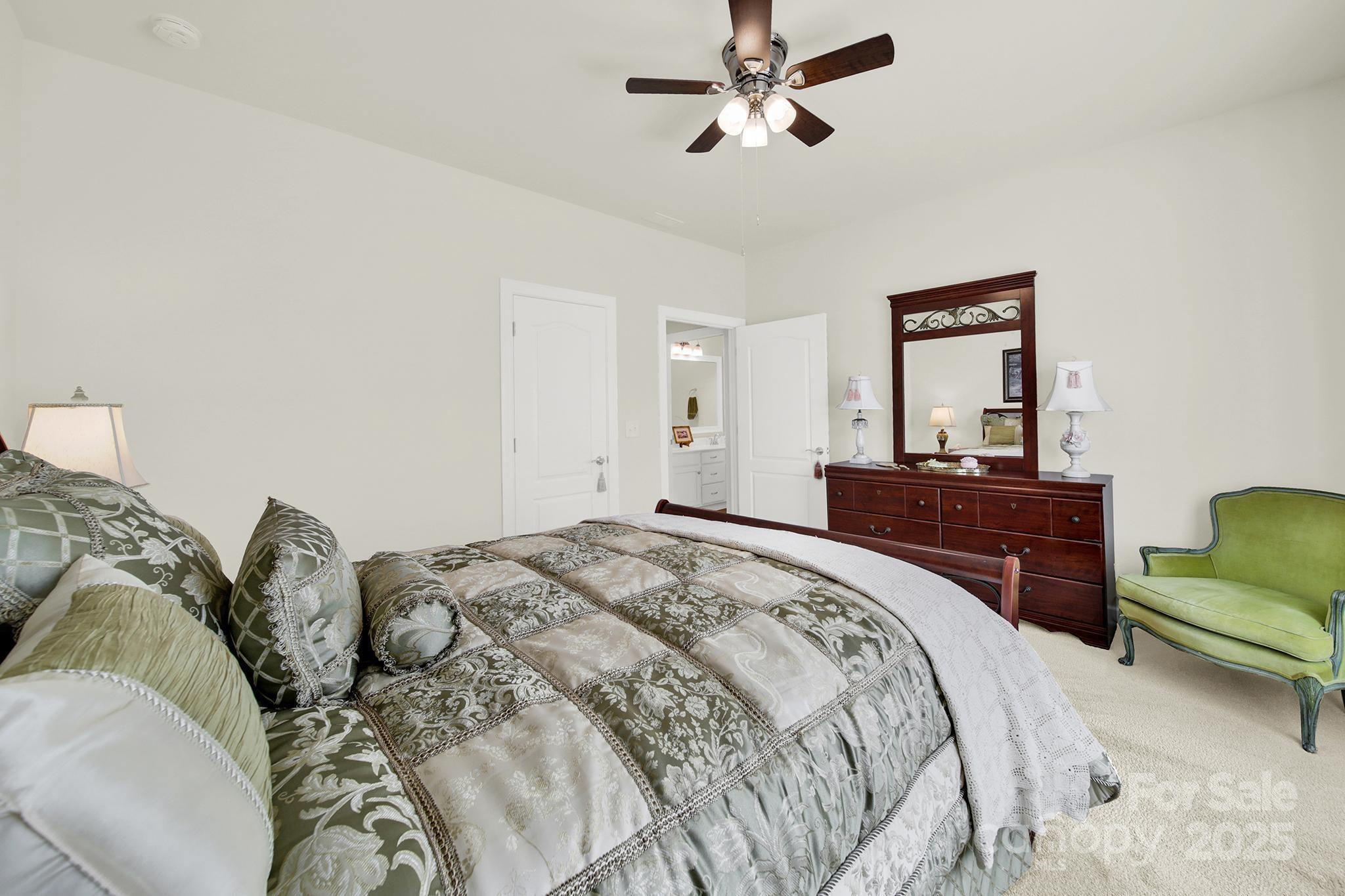 3097 Arches Bluff Circle Lancaster, SC 29720 - Photo 21 of 40 a bed room with a bed and a couch