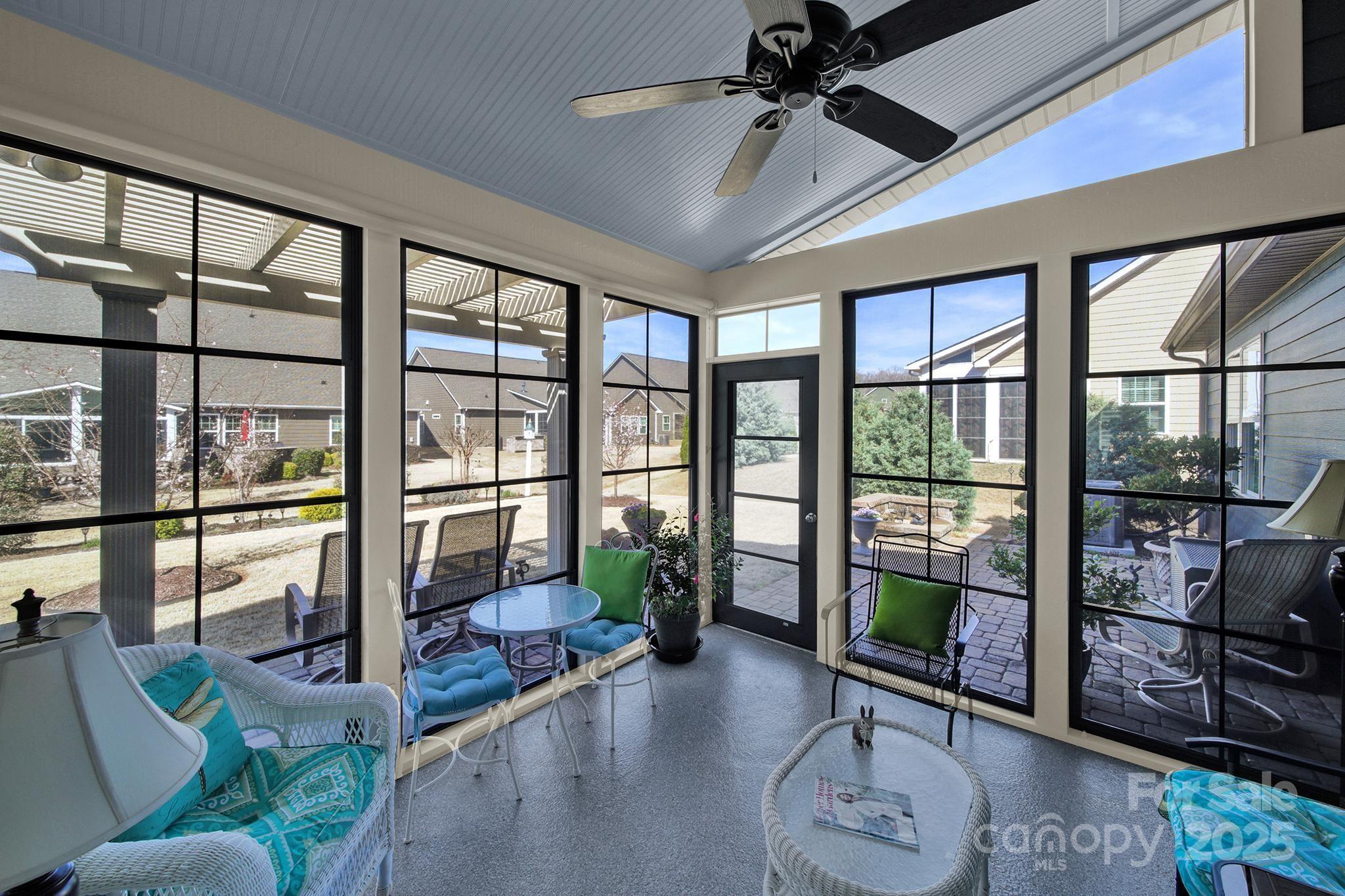 3097 Arches Bluff Circle Lancaster, SC 29720 - Photo 27 of 40 a living room with furniture and a floor to ceiling window
