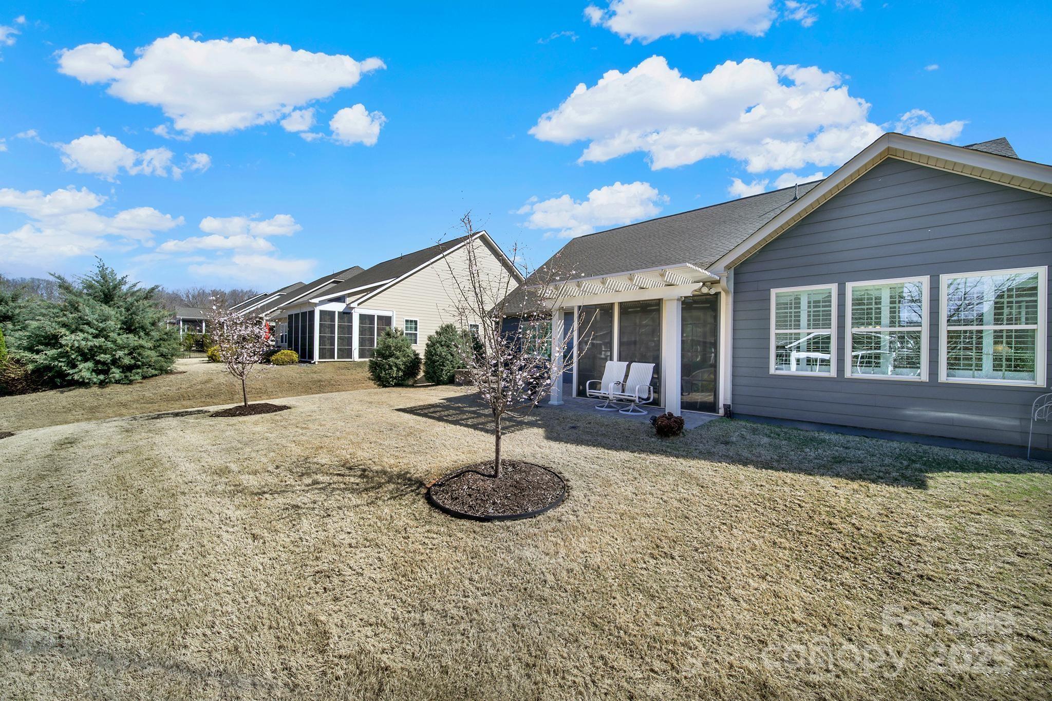 3097 Arches Bluff Circle Lancaster, SC 29720 - Photo 32 of 40 a house with lots of trees in the background