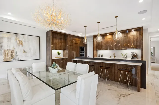 a living room with a couch and a potted plant
