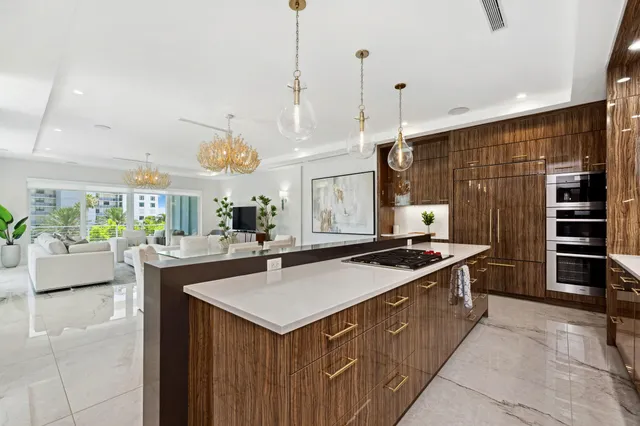 a living room with furniture a rug and a large window