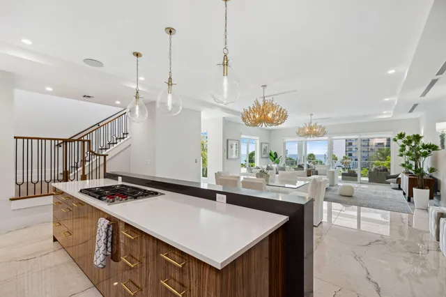 a kitchen with a sink a window and cabinets