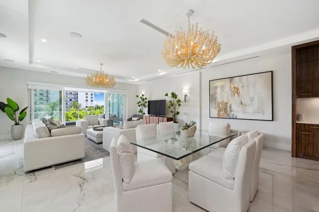 a bedroom with a bed couch and a large window