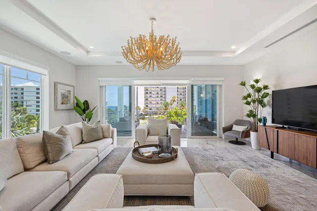a bathroom with a granite countertop toilet sink and mirror