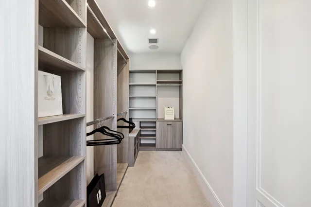 a large bathroom with a double vanity sink a mirror and a bathtub