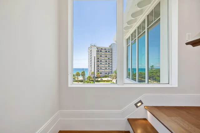 a kitchen with a refrigerator and a sink