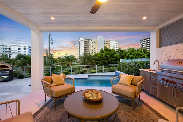 a living room with furniture and a painting