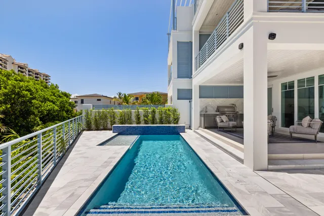 a bathroom with a granite countertop sink a toilet and mirror