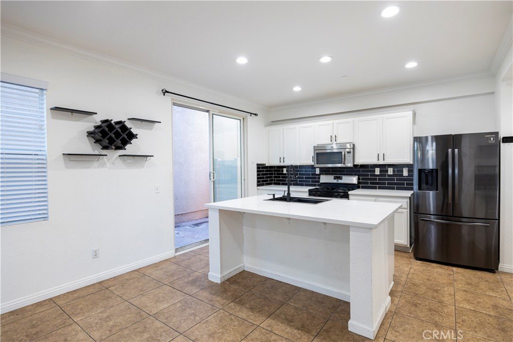 1864 Siena Court Riverside, CA 92501 - Photo 6 of 22 Kitchen/Exit to Patio.