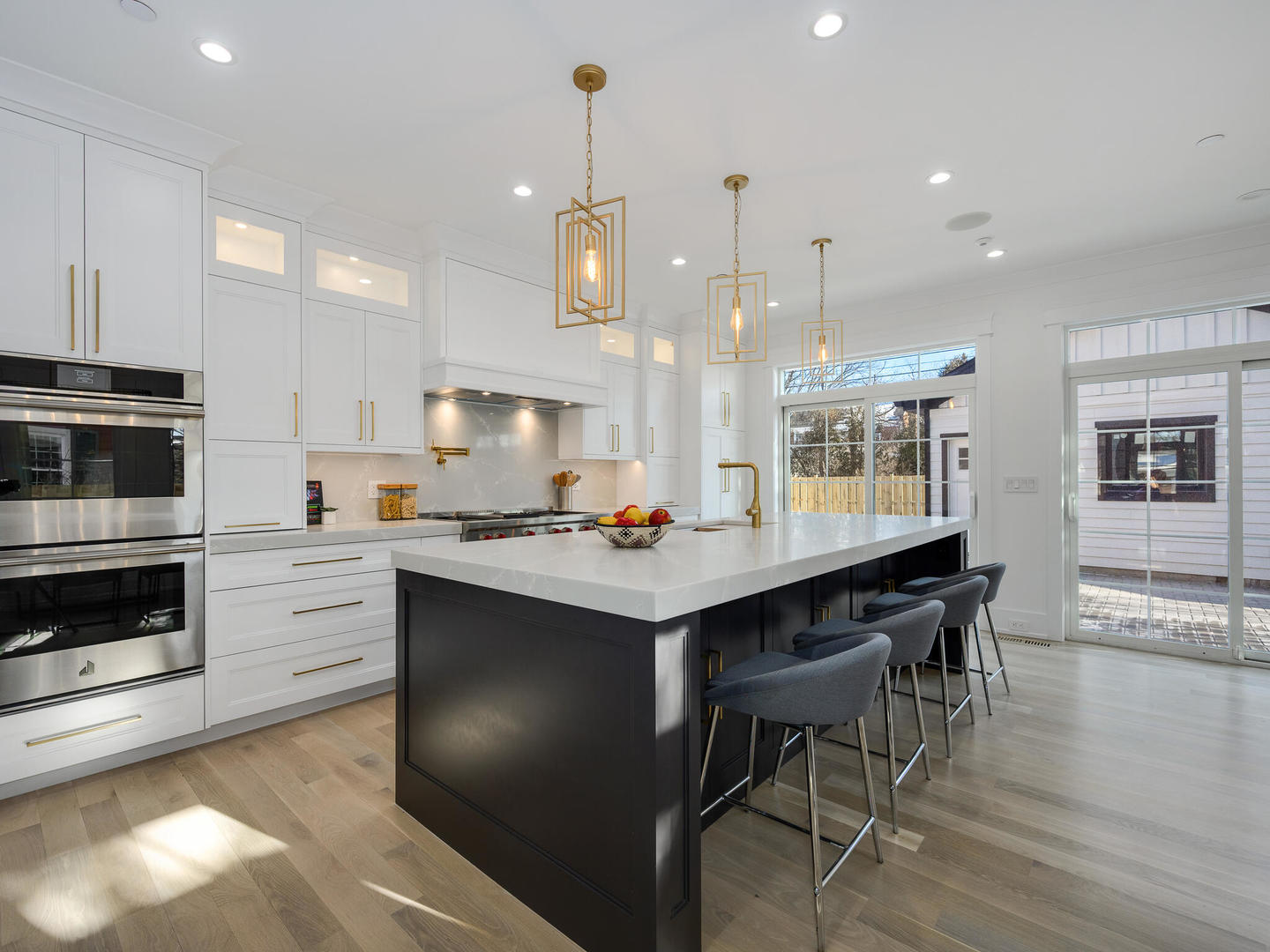 1115 South Delphia Avenue Park Ridge, IL 60068 - Photo 11 of 38 a kitchen with kitchen island stainless steel appliances a dining table chairs sink and stove
